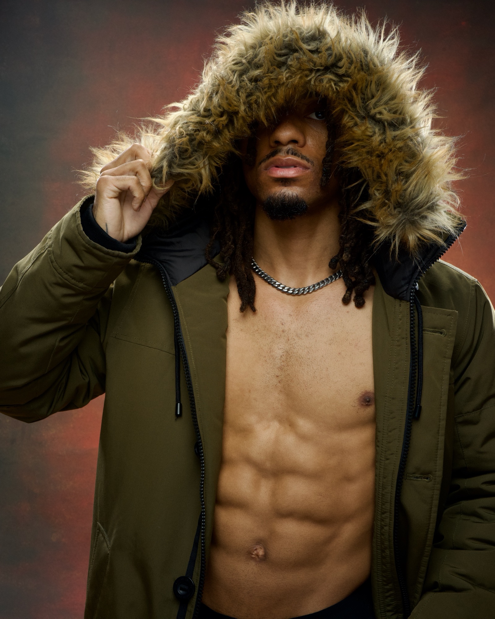 Boxer Jordan King in fur-lined parka, studio portrait at the Post Road Loft.